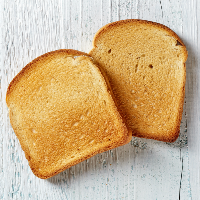 Кусок тостового хлеба. Хлеб. Кусок хлеба сверху. Хлебобулочные изделия вид сверху.